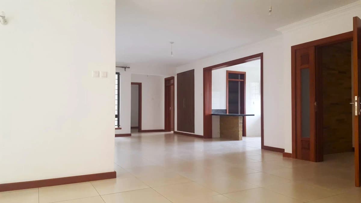 Spacious hallway with polished concrete floor and wooden doors