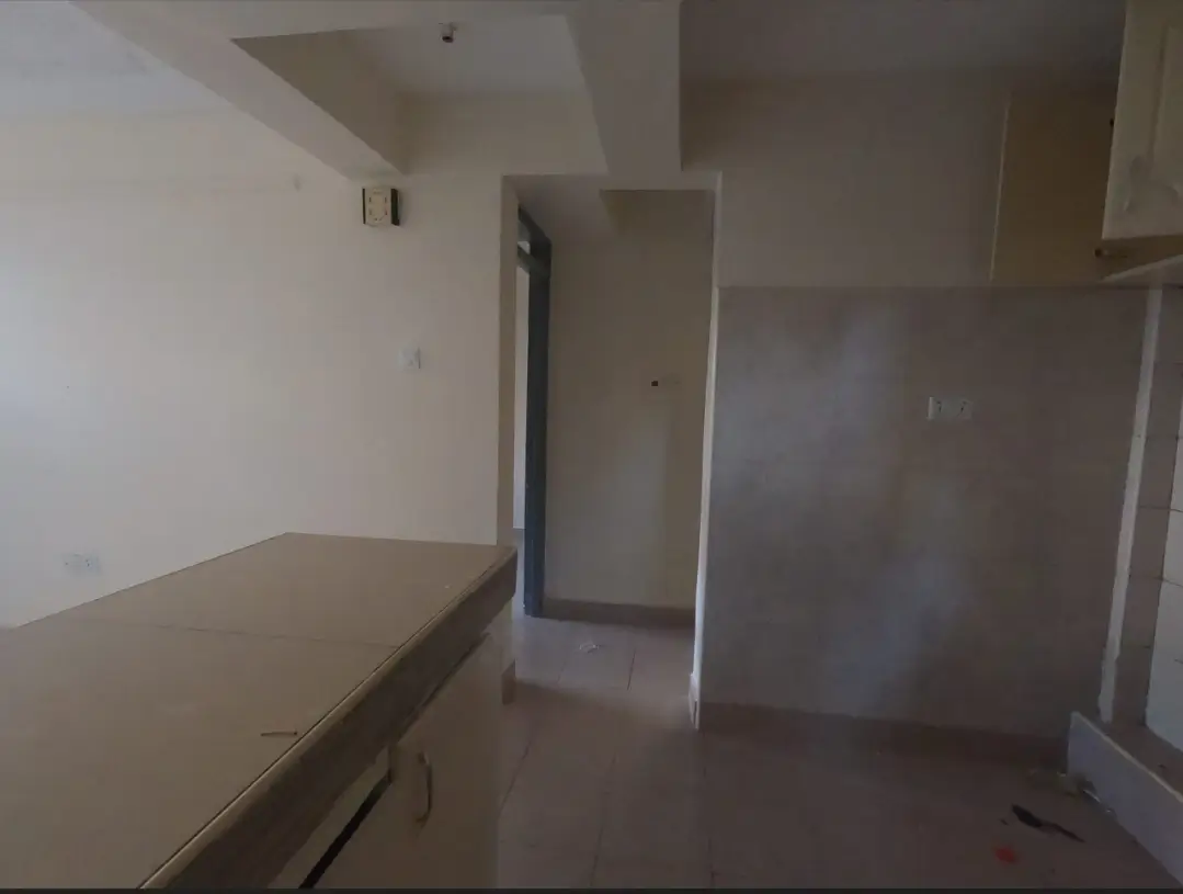 Compact kitchen with countertop and minimal fixtures