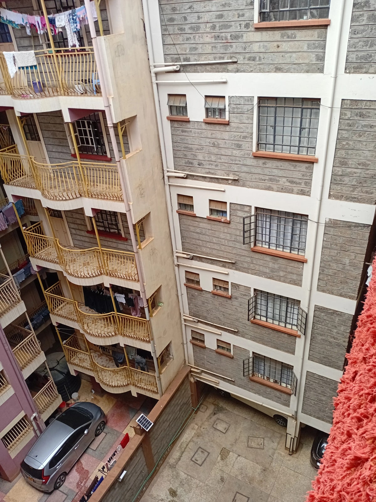Multi-story residential building facade with balconies and windows