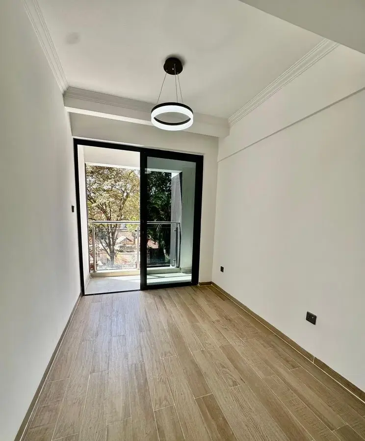 Modern balcony with glass sliding doors and wooden flooring