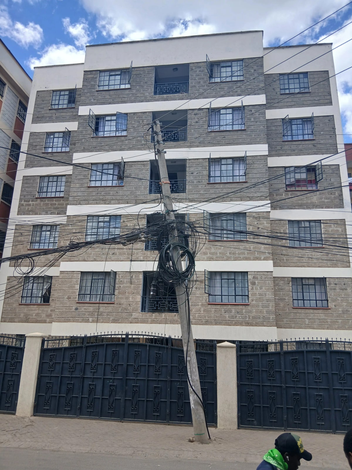 Modern apartment building facade with parking bays below