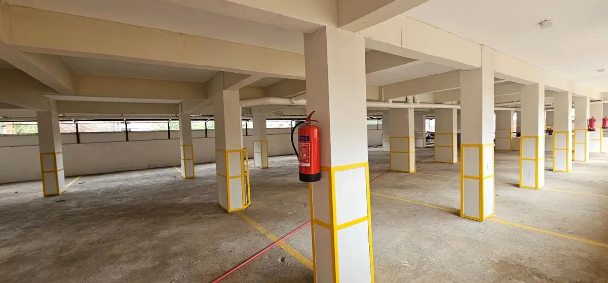 Multi-level basement parking with yellow safety columns