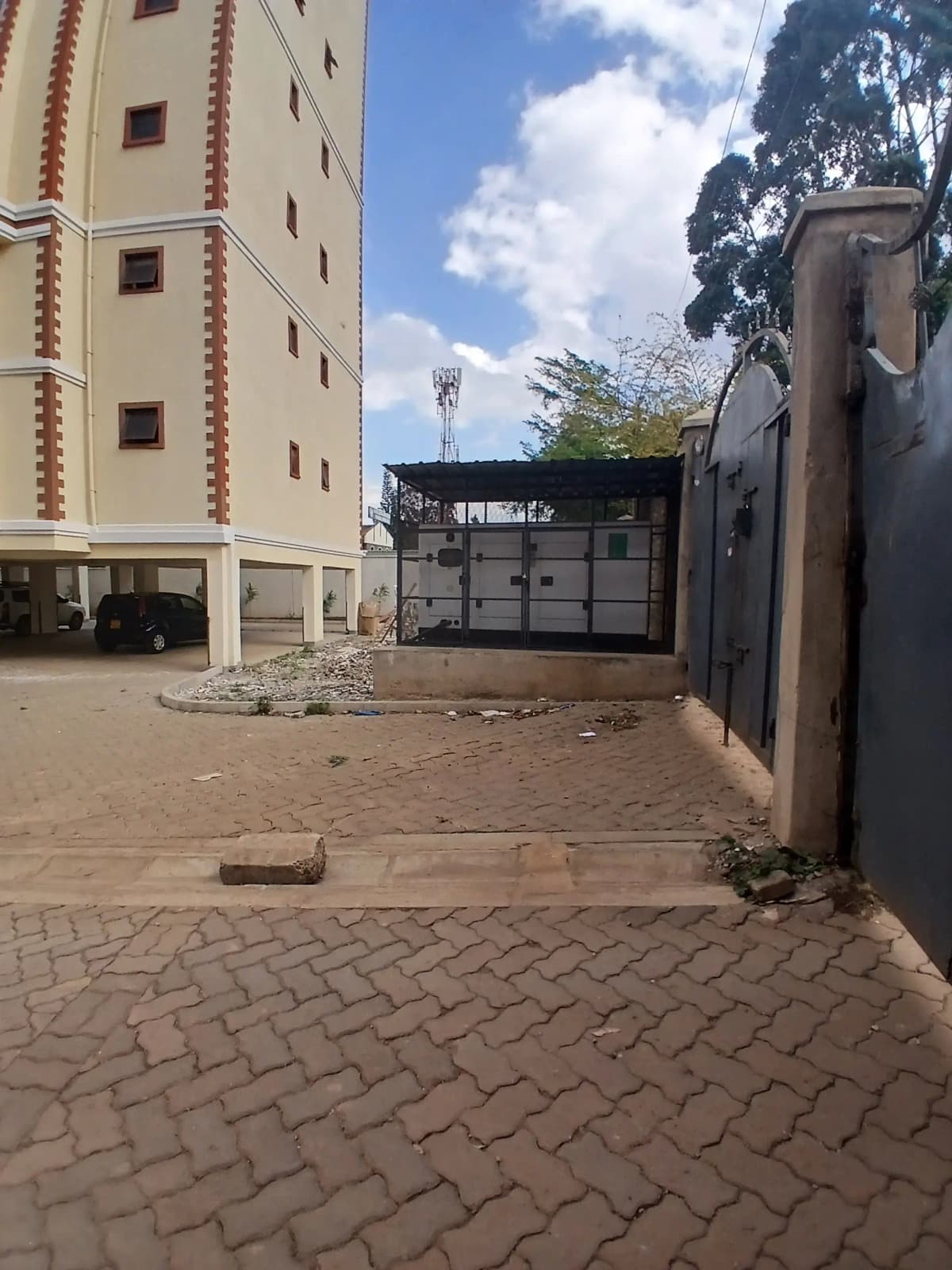 Compound parking area with paved ground and building access