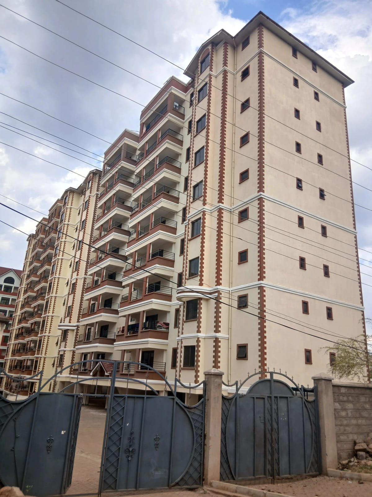 Multi-story residential apartment building facade with balconies
