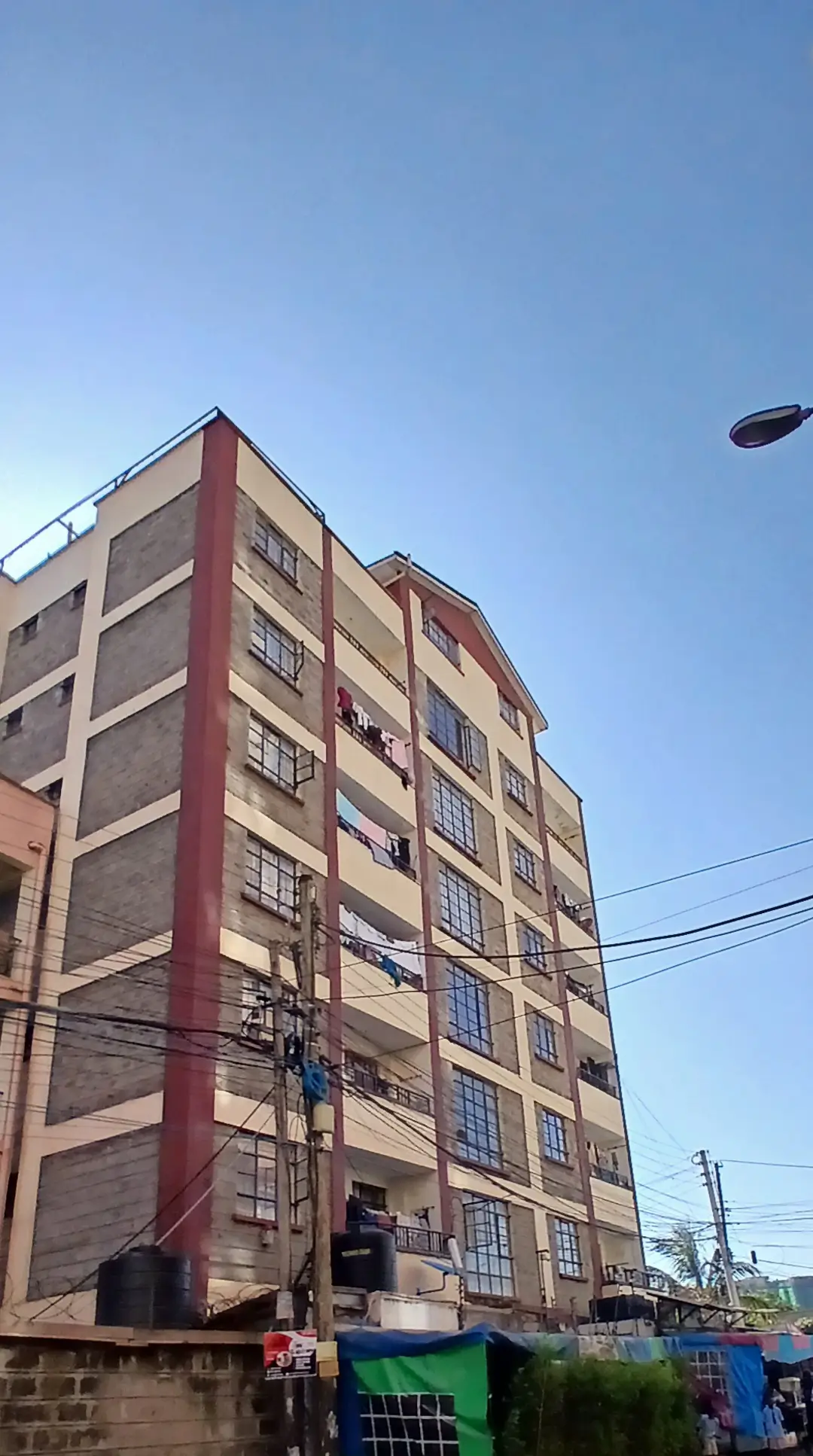 Multi-story residential building facade with commercial ground floor