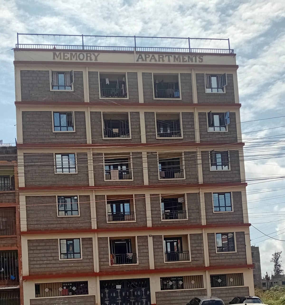 Multi-story residential building facade with balanced window grid