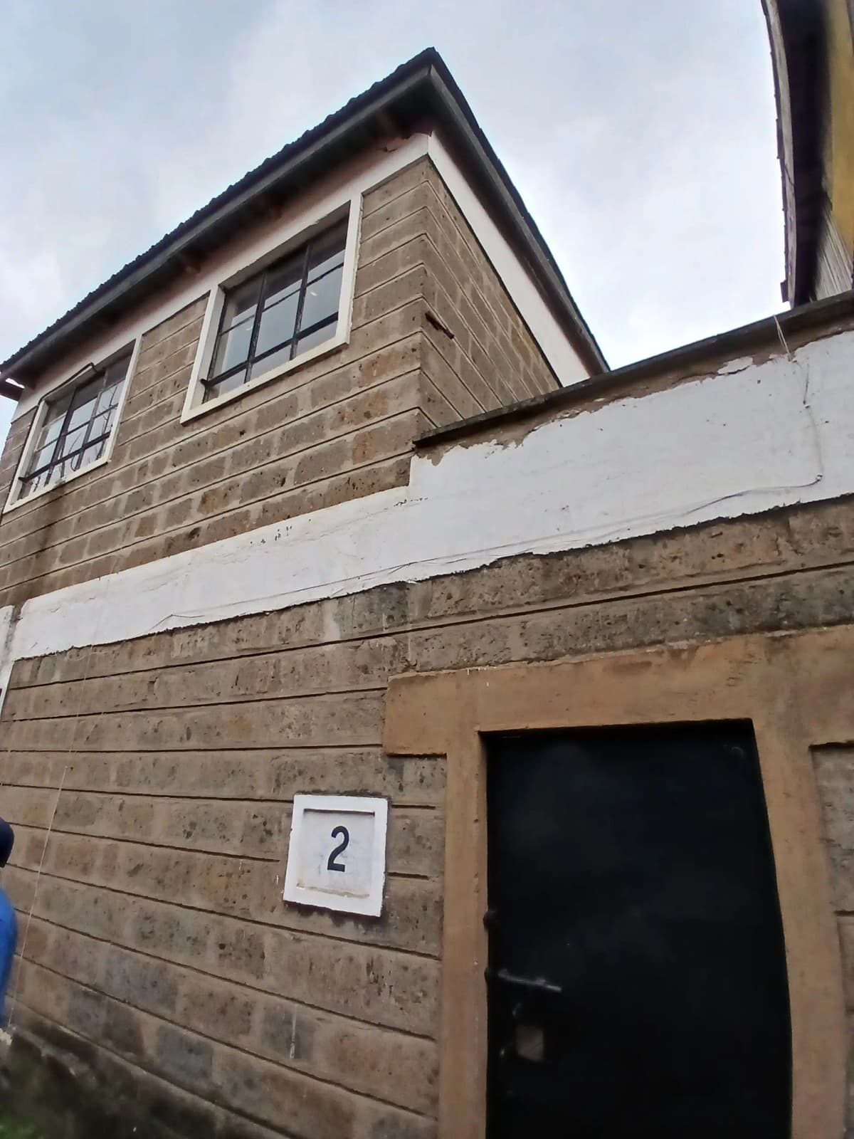 Modern brick facade with numbered entrance door