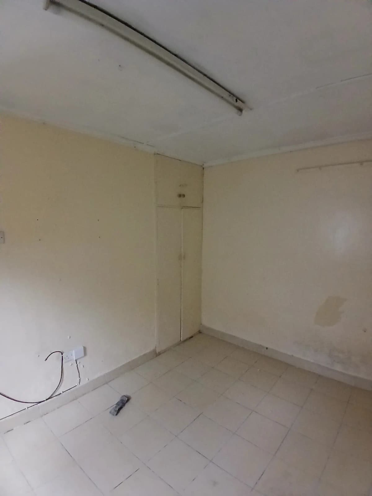 Empty room under construction with exposed wiring