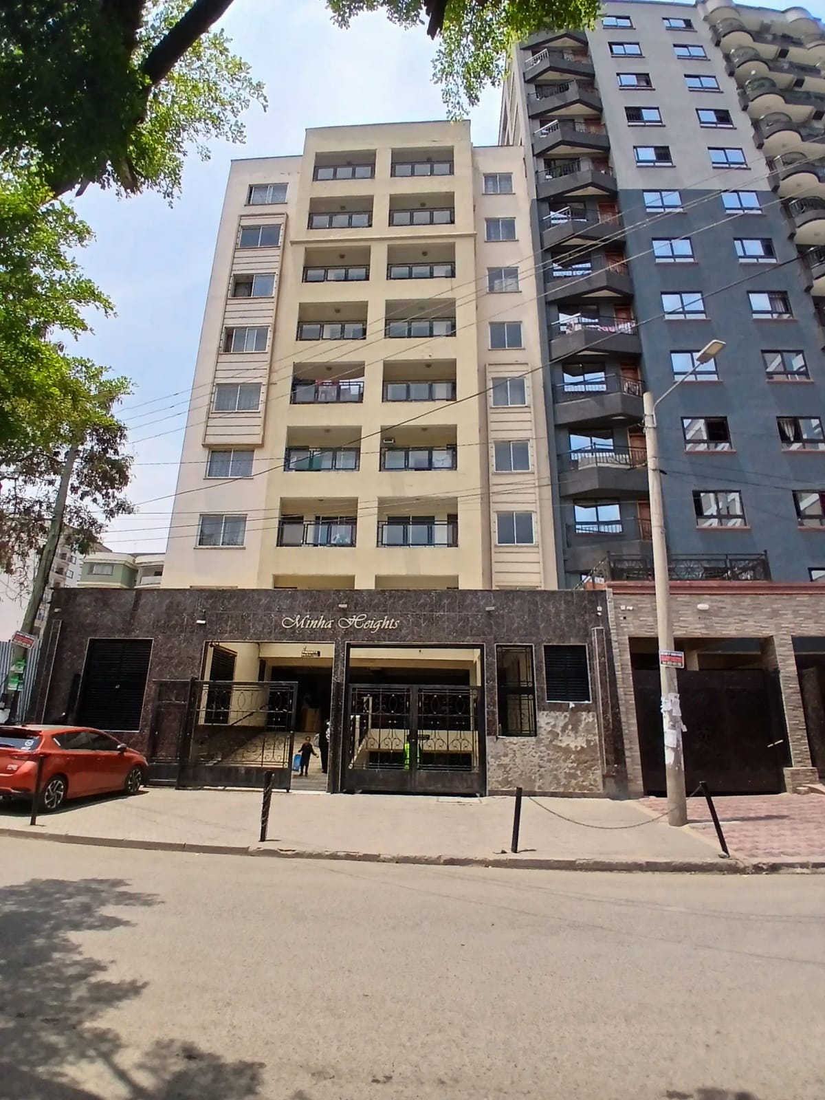 Multi-story residential building facade with street frontage