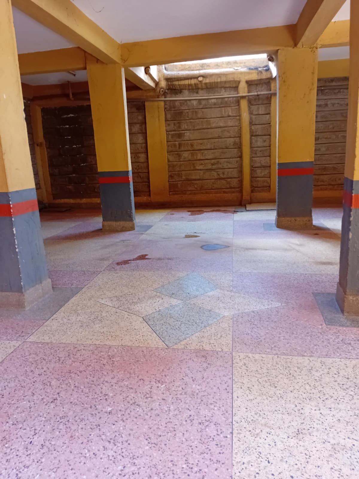 Covered basement parking with colored floor markings