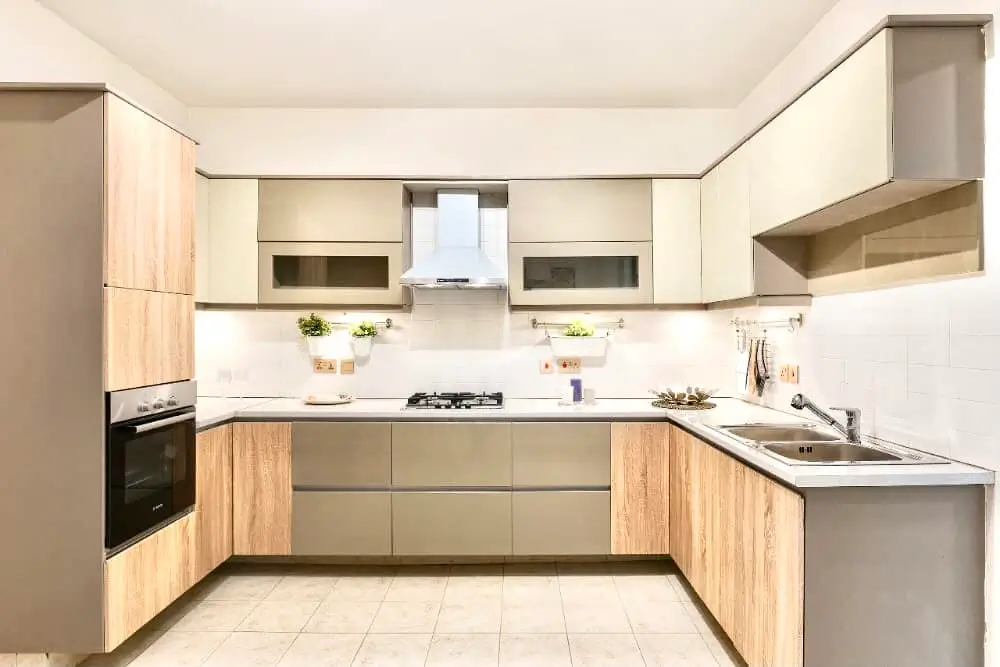 Modern U-shaped kitchen with wood and taupe cabinetry