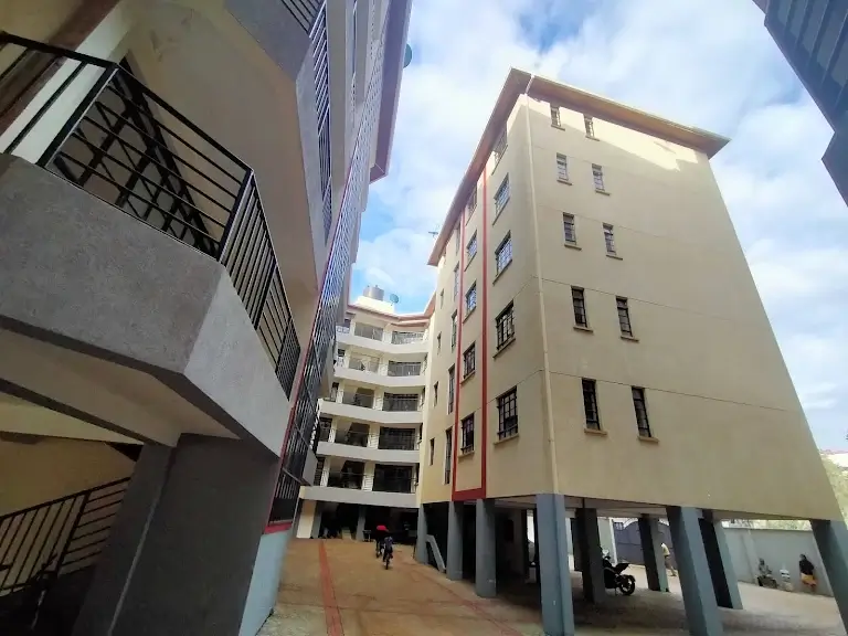 Modern residential apartment complex with elevated parking base