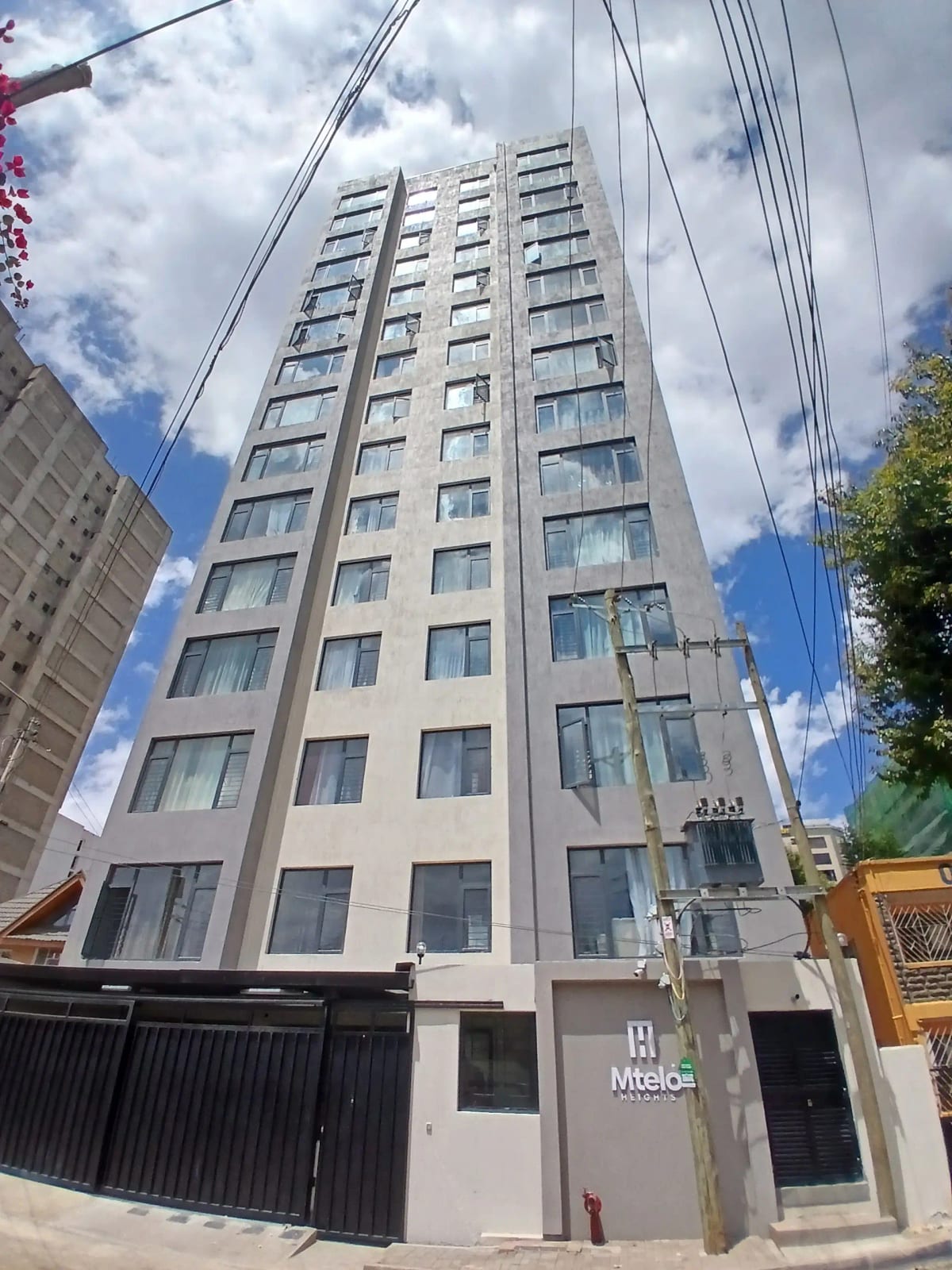 Modern residential apartment building facade with multiple floors