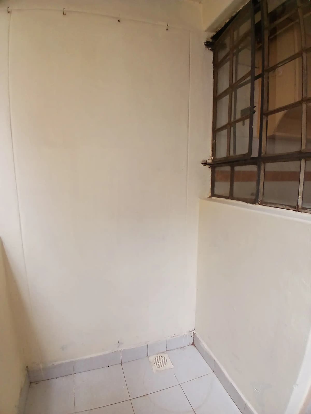 Small corridor or entrance foyer with tiled floor