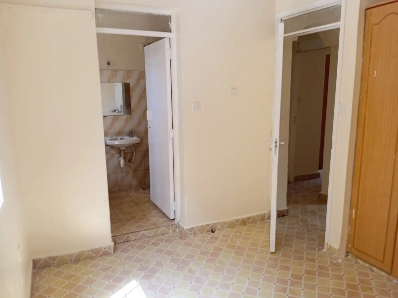 Central hallway with bathroom and bedroom access doors
