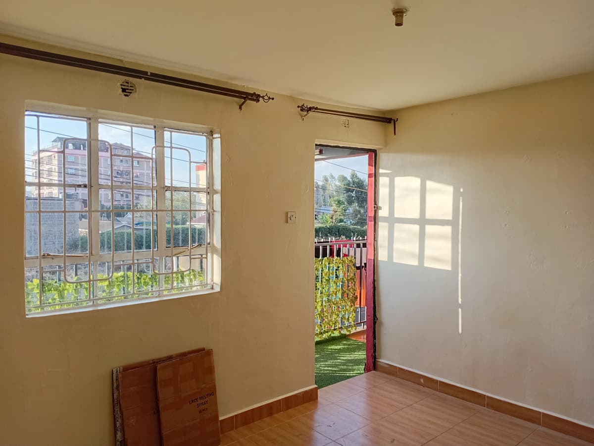 Bright living room with large windows and garden access