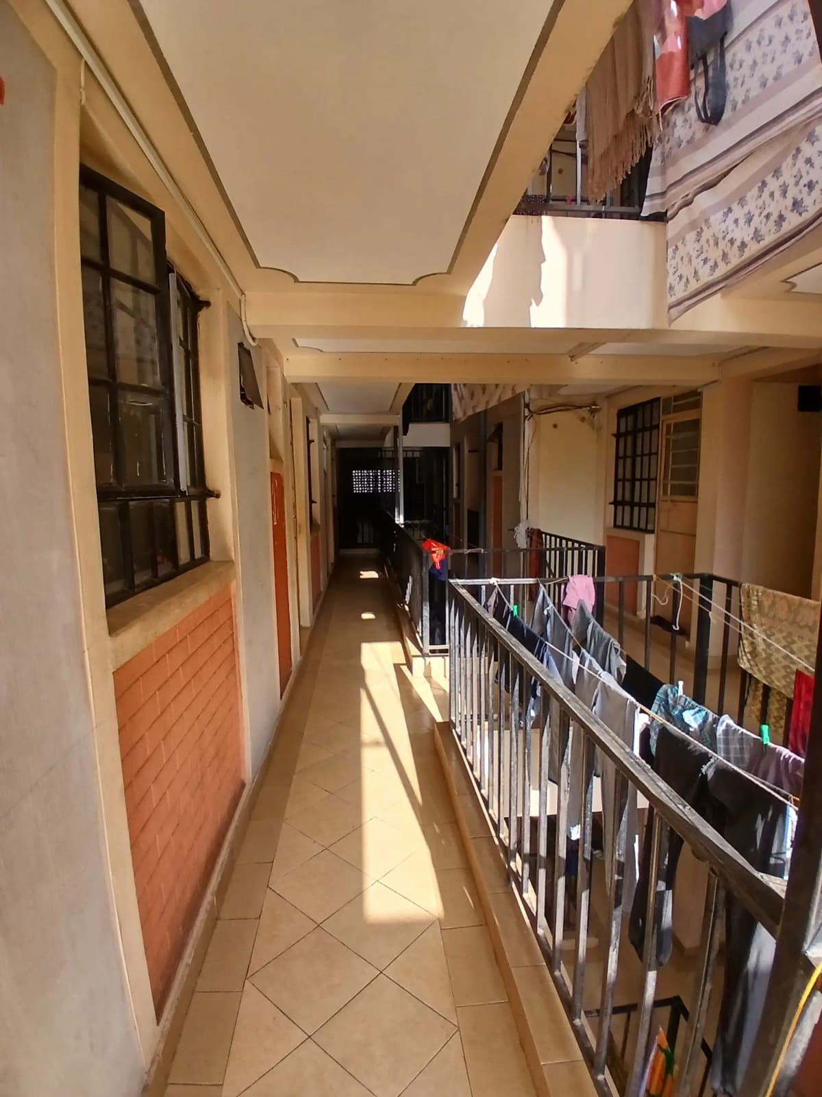 Multi-level internal corridor with staircase and railings