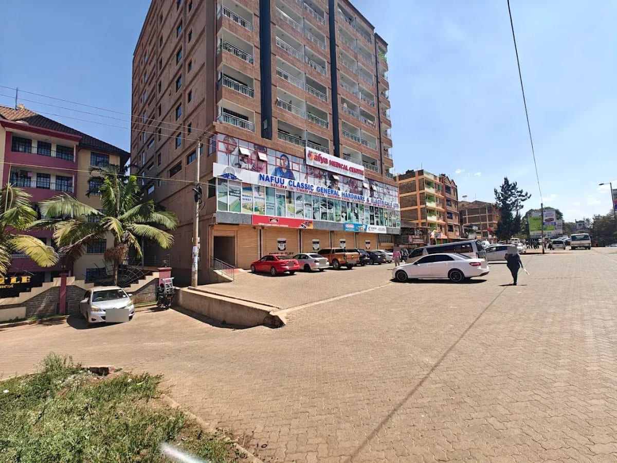 Multi-story residential building with ground-level parking area