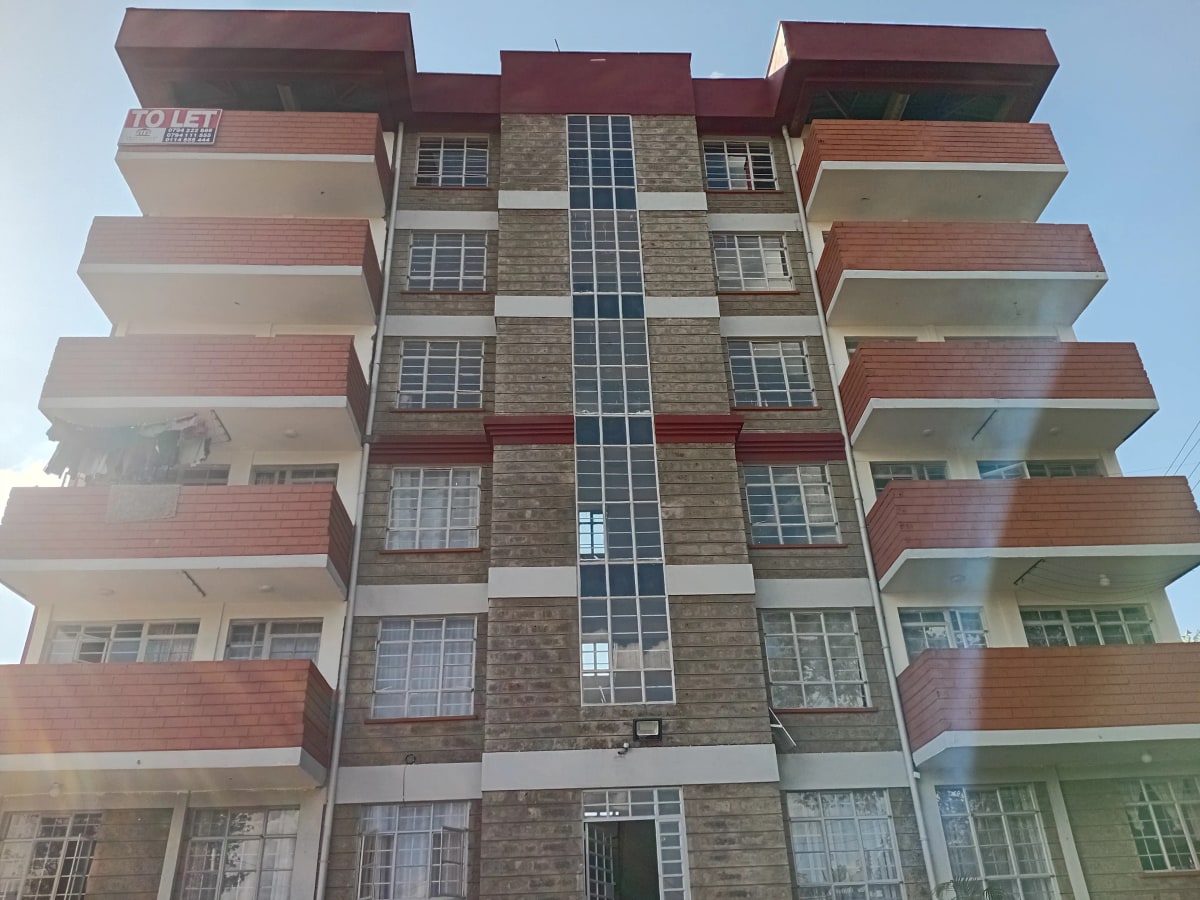 Multi-story residential apartment building facade with balconies