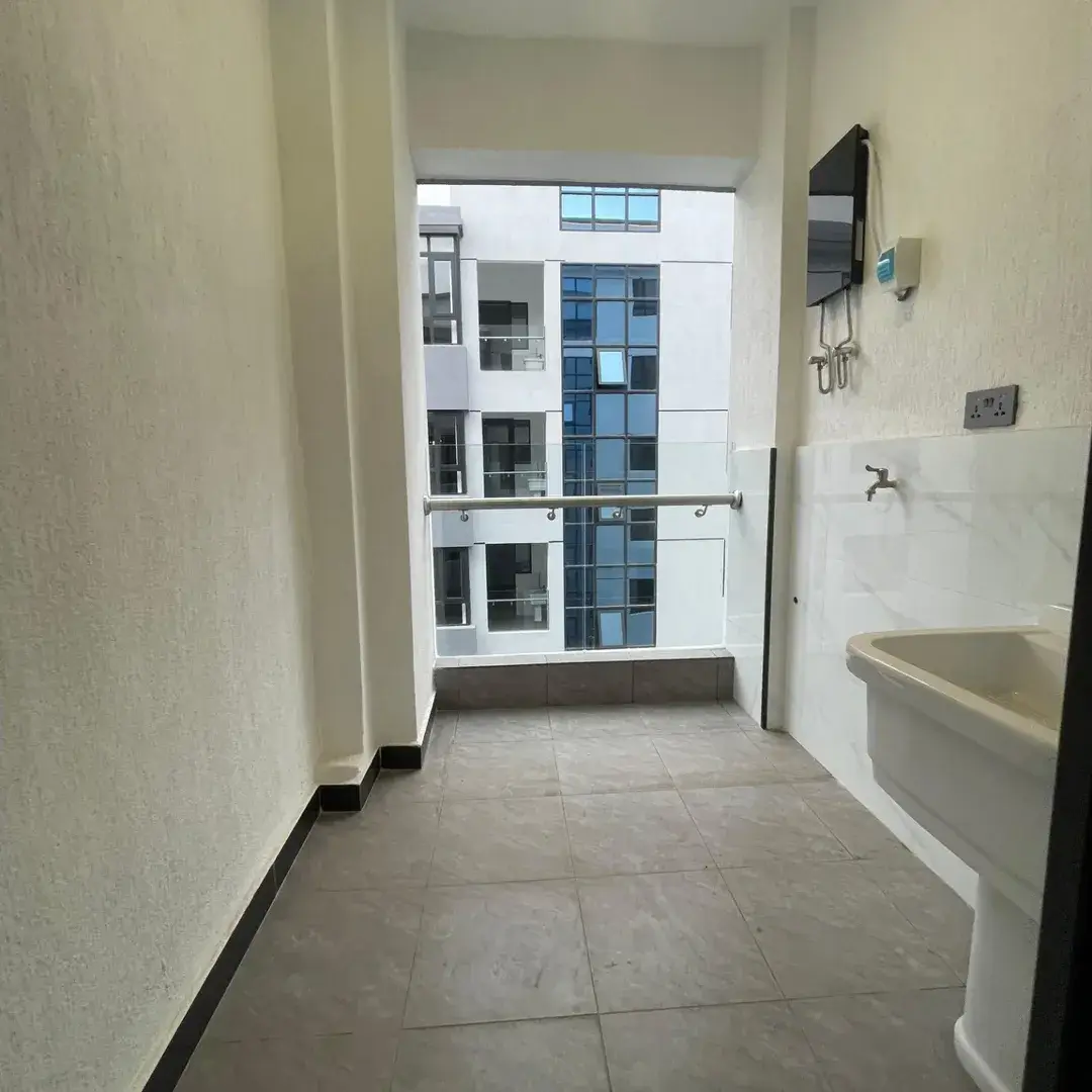 Modern laundry area with building view and open air balcony