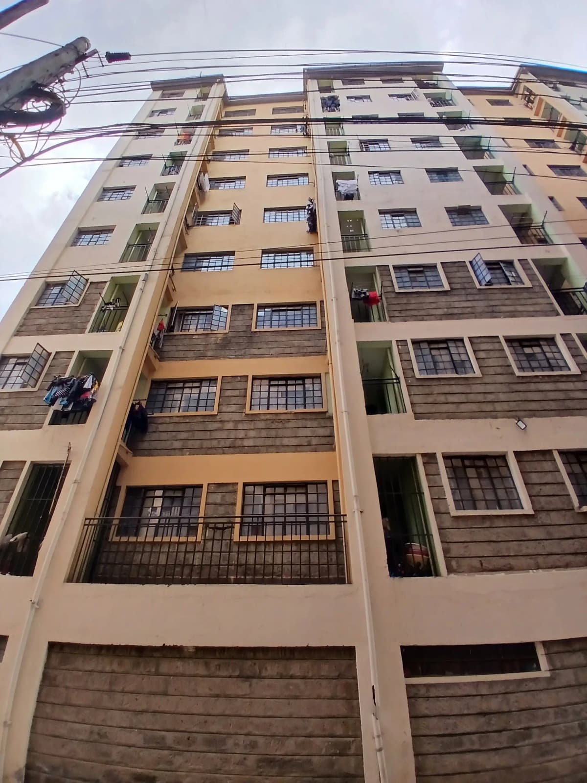 Multi-story residential building facade with balconies and windows