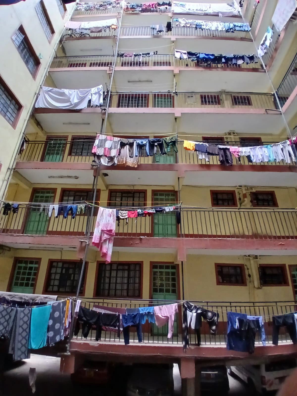 Multi-story residential building facade with multiple balconies