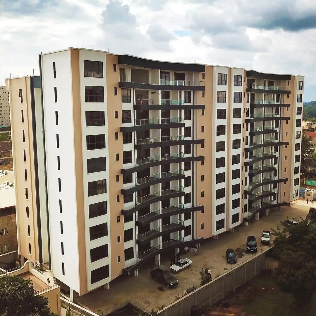 Modern multi-story apartment building with cream and tan facade