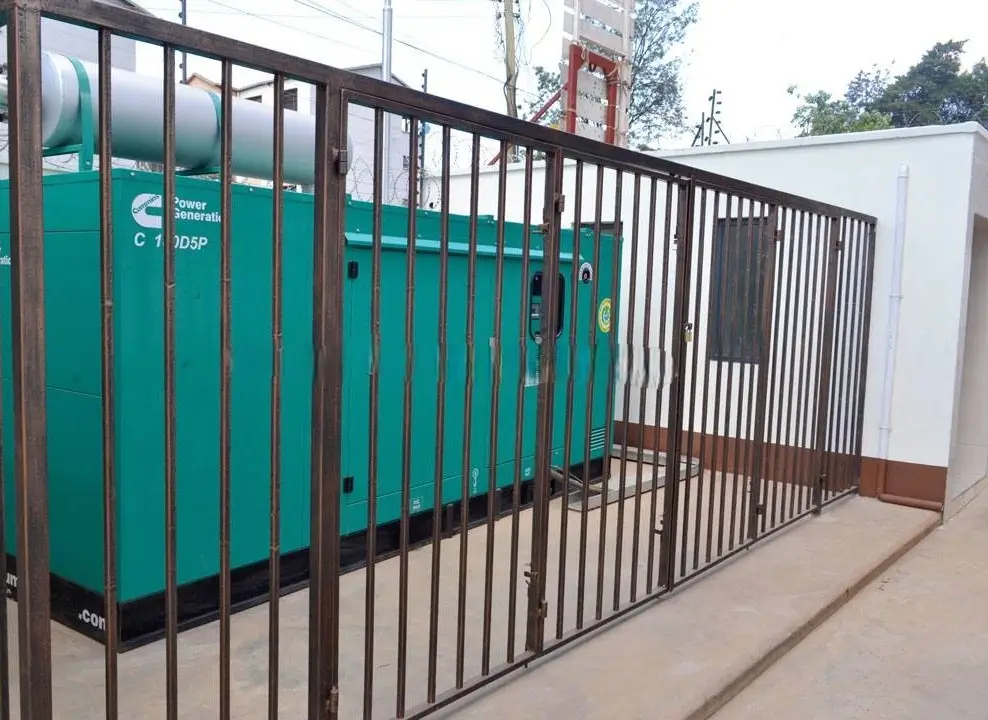 Secured parking bay with teal and black metal gate