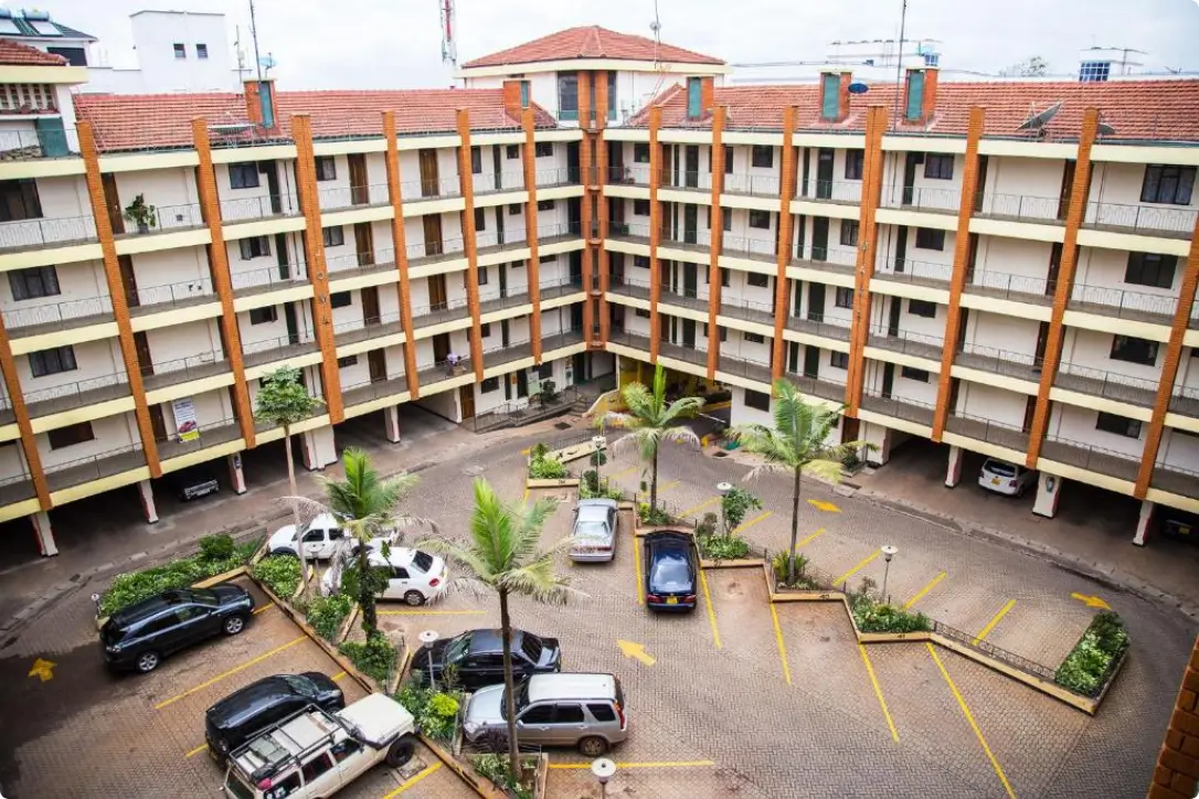 Multi-level apartment compound with central parking court