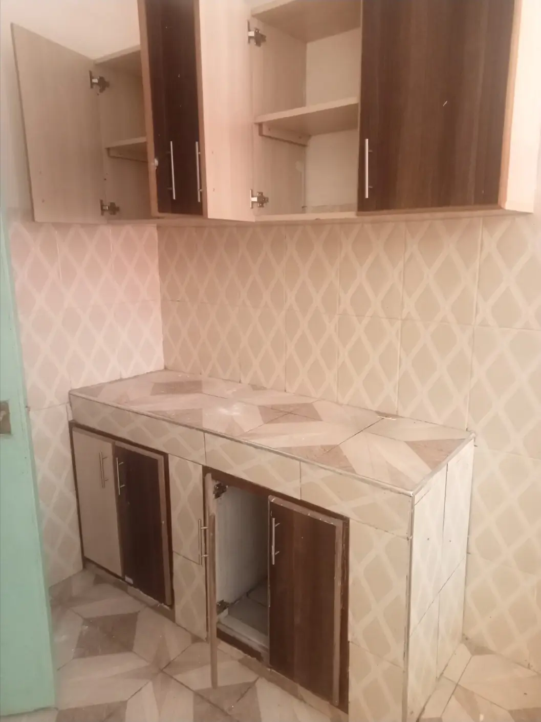Modern bathroom vanity with dual mirrors and geometric tile backsplash