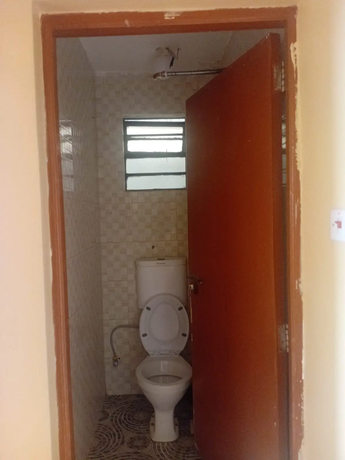 Small bathroom with toilet and window ventilation