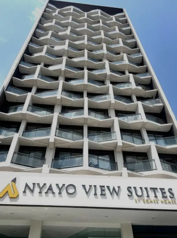 Modern multi-story residential building facade with curved balconies