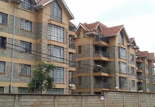 Multi-story residential apartment building with stone facade