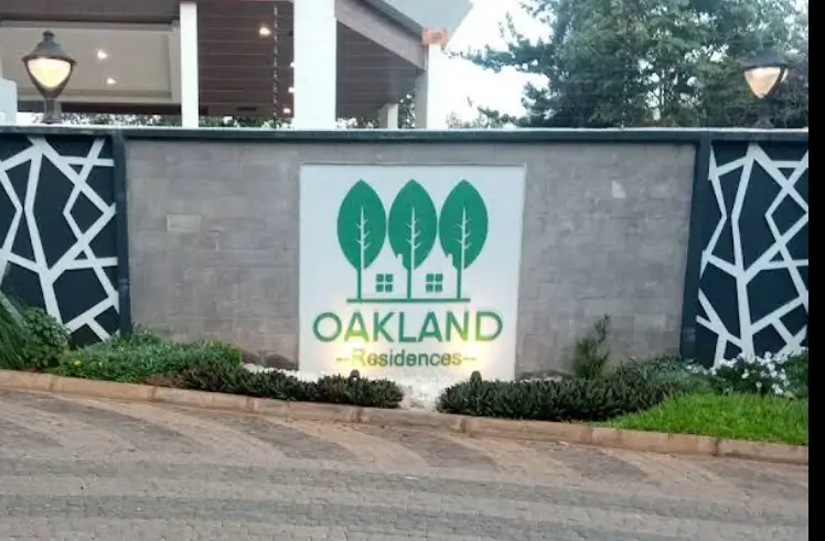Oakland Residences entrance gate with branded signage
