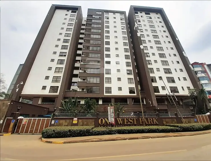 Multi-story residential complex with modern facade and landscaping