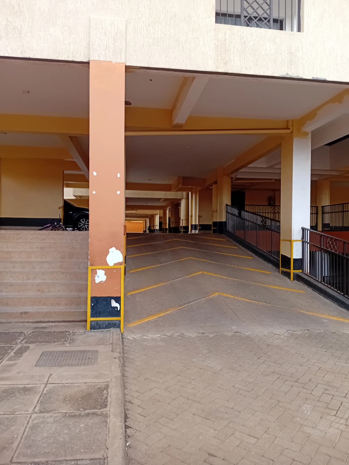 Covered basement parking with yellow line markings