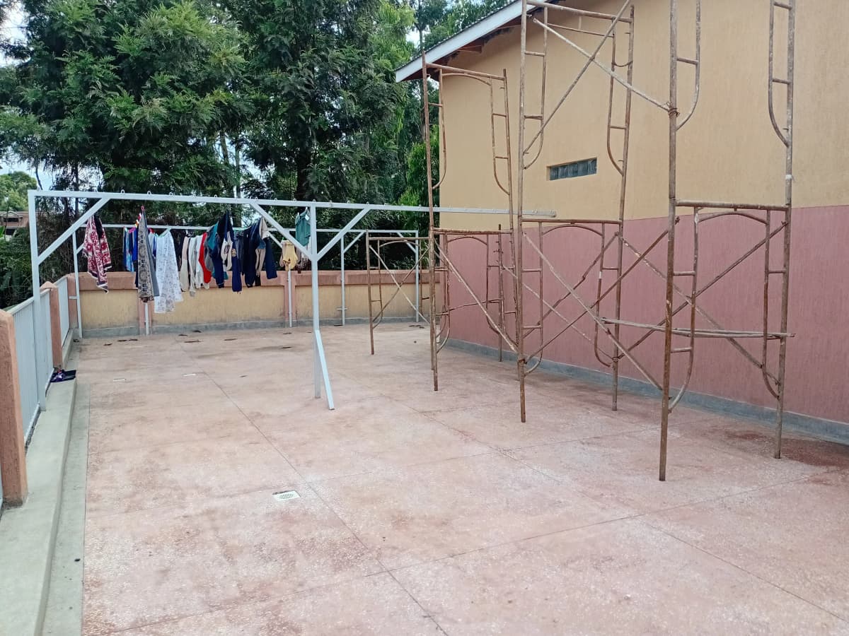 Compound courtyard with clothesline and building facade