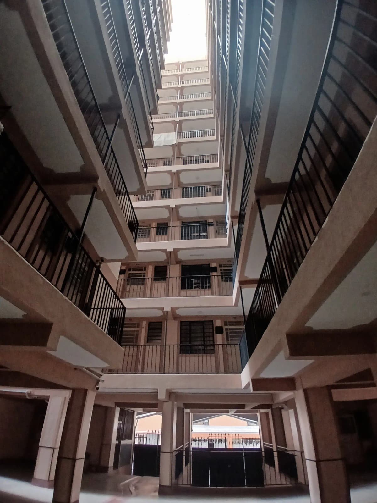 Multi-story atrium lobby with central courtyard and balconies