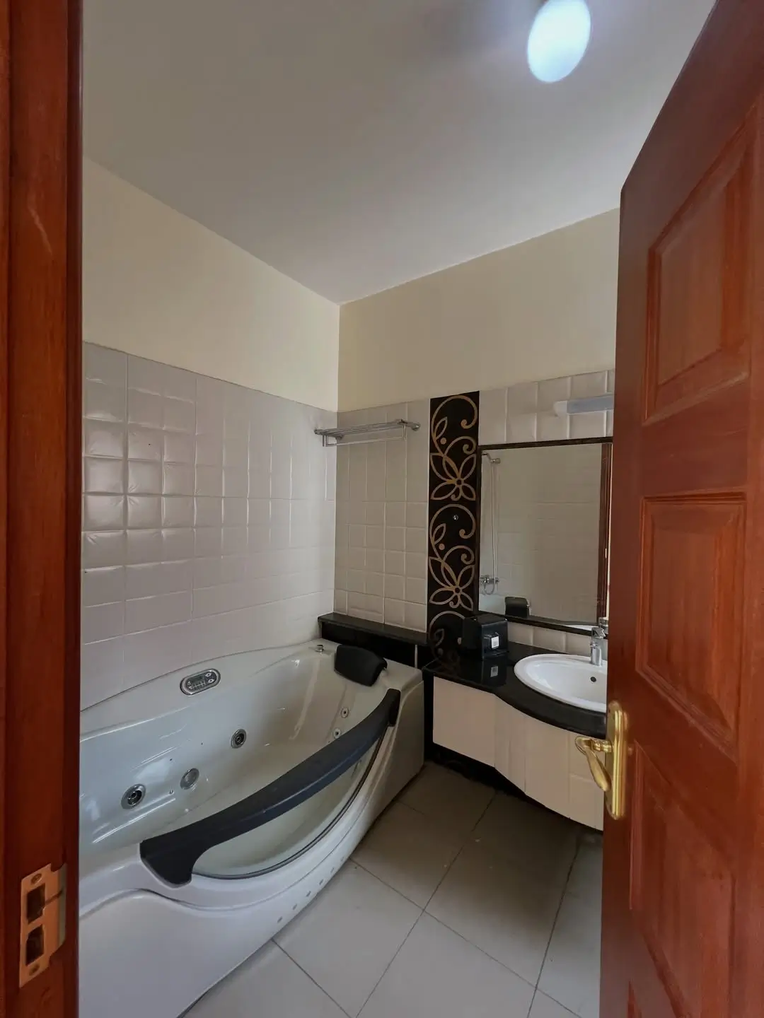 Modern bathroom with jacuzzi tub and vanity sink