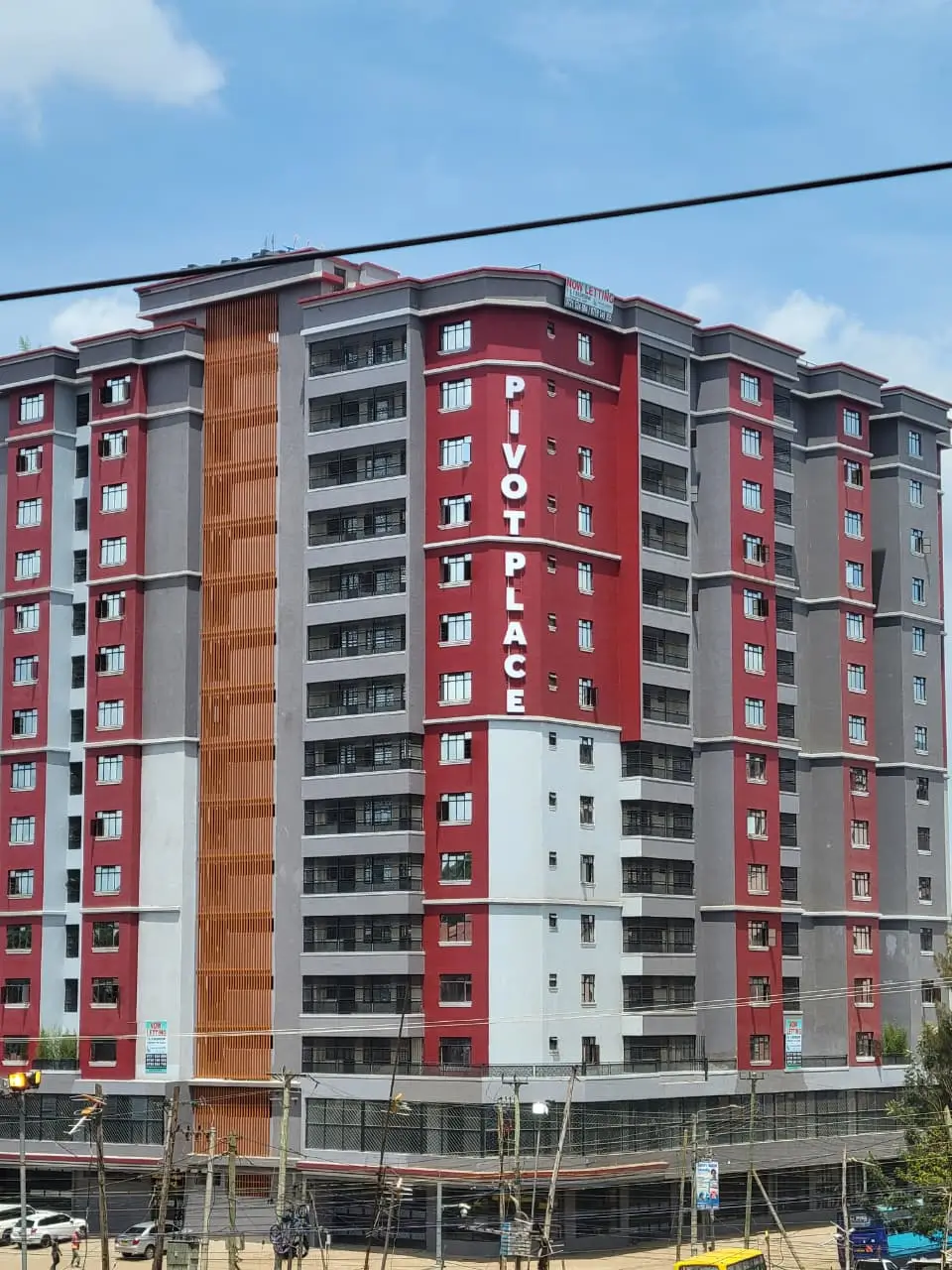 Red and gray multi-story residential apartment building facade