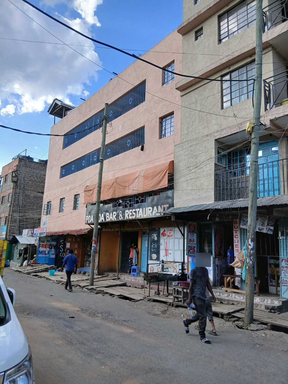 Multi-story residential building with ground floor commercial space