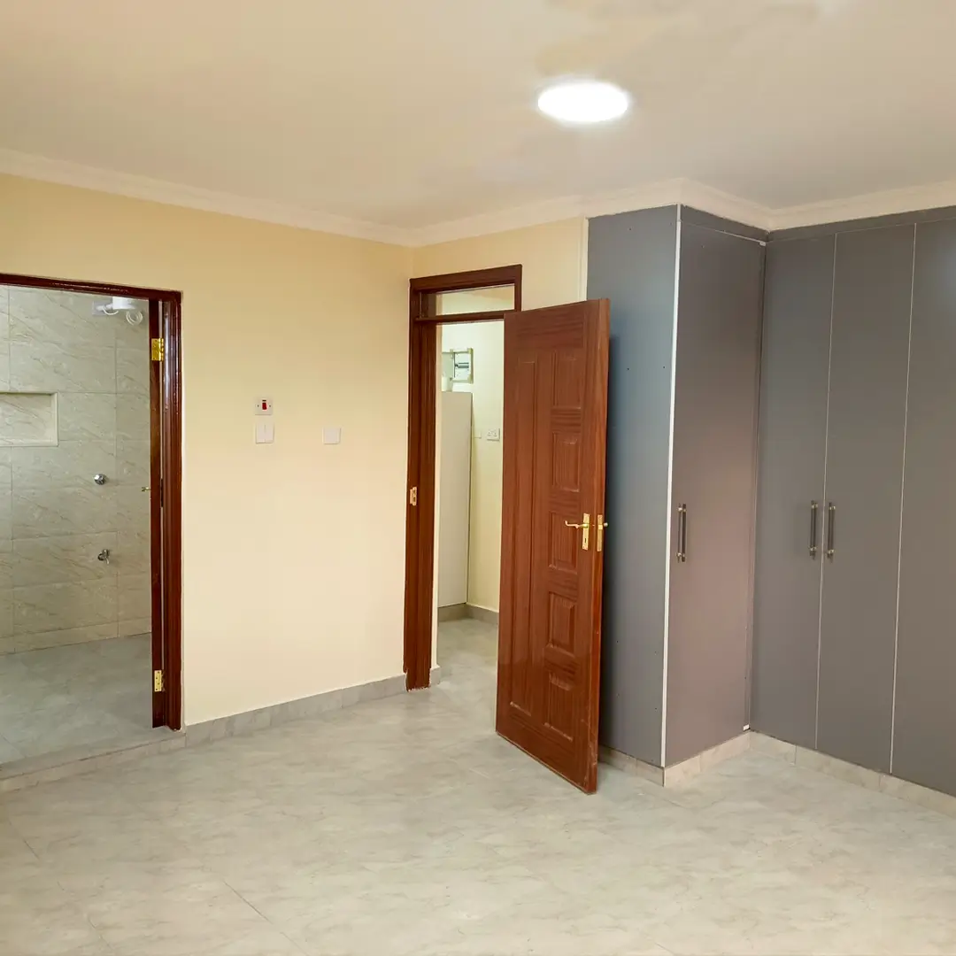 Spacious bedroom with ensuite bathroom and built-in wardrobes