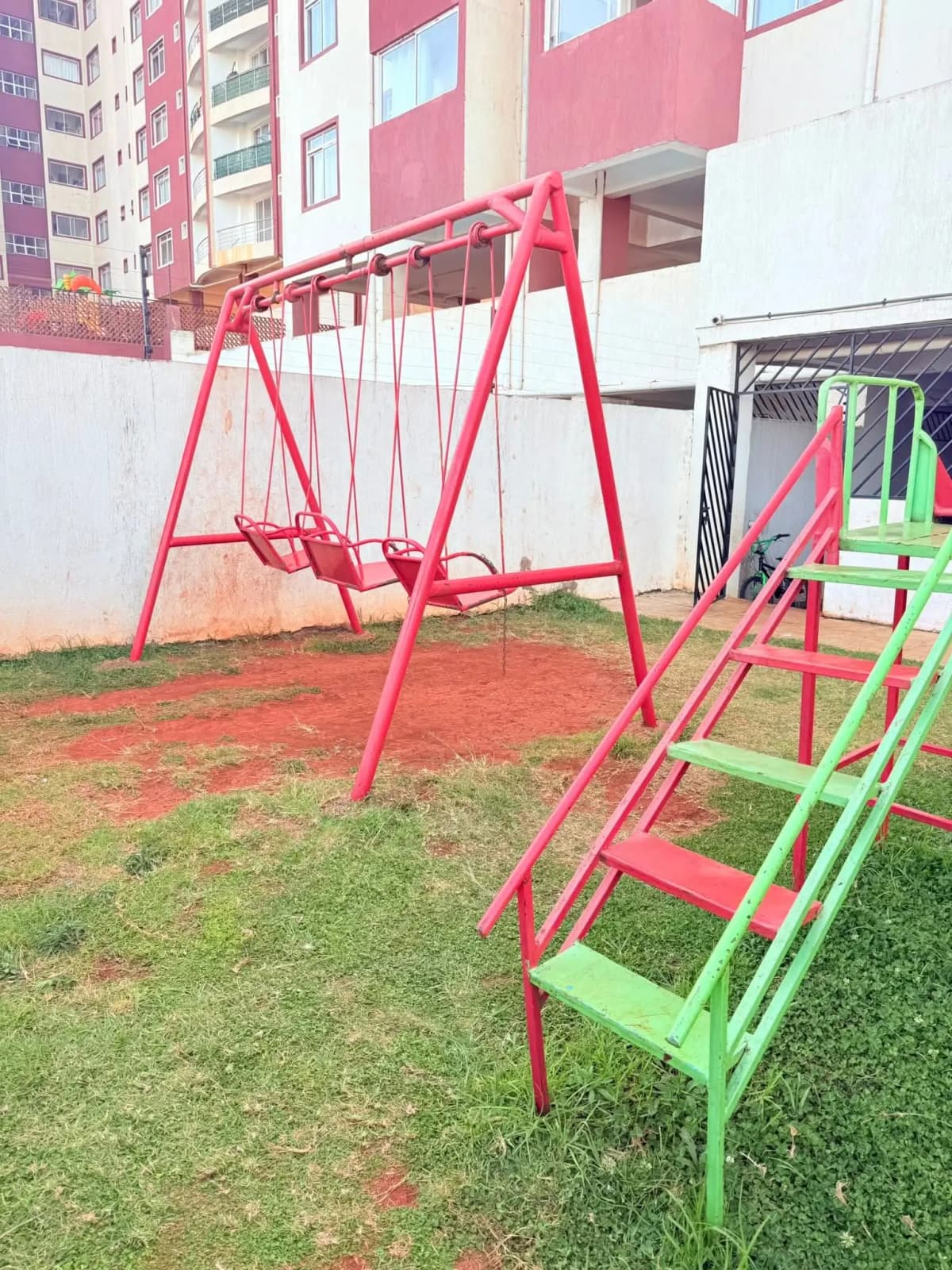 Children's playground with swing set and climbing equipment