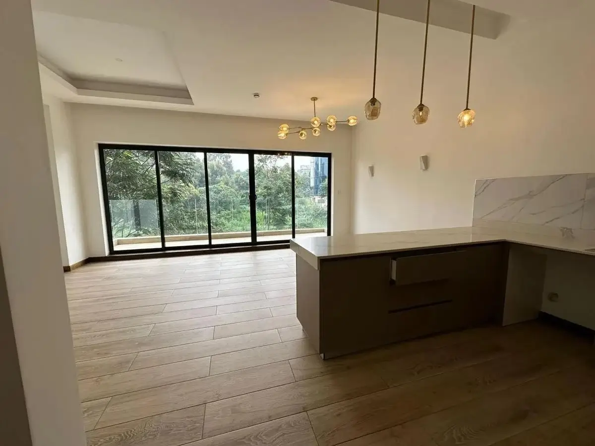 Open-plan living space with large windows and pendant lighting