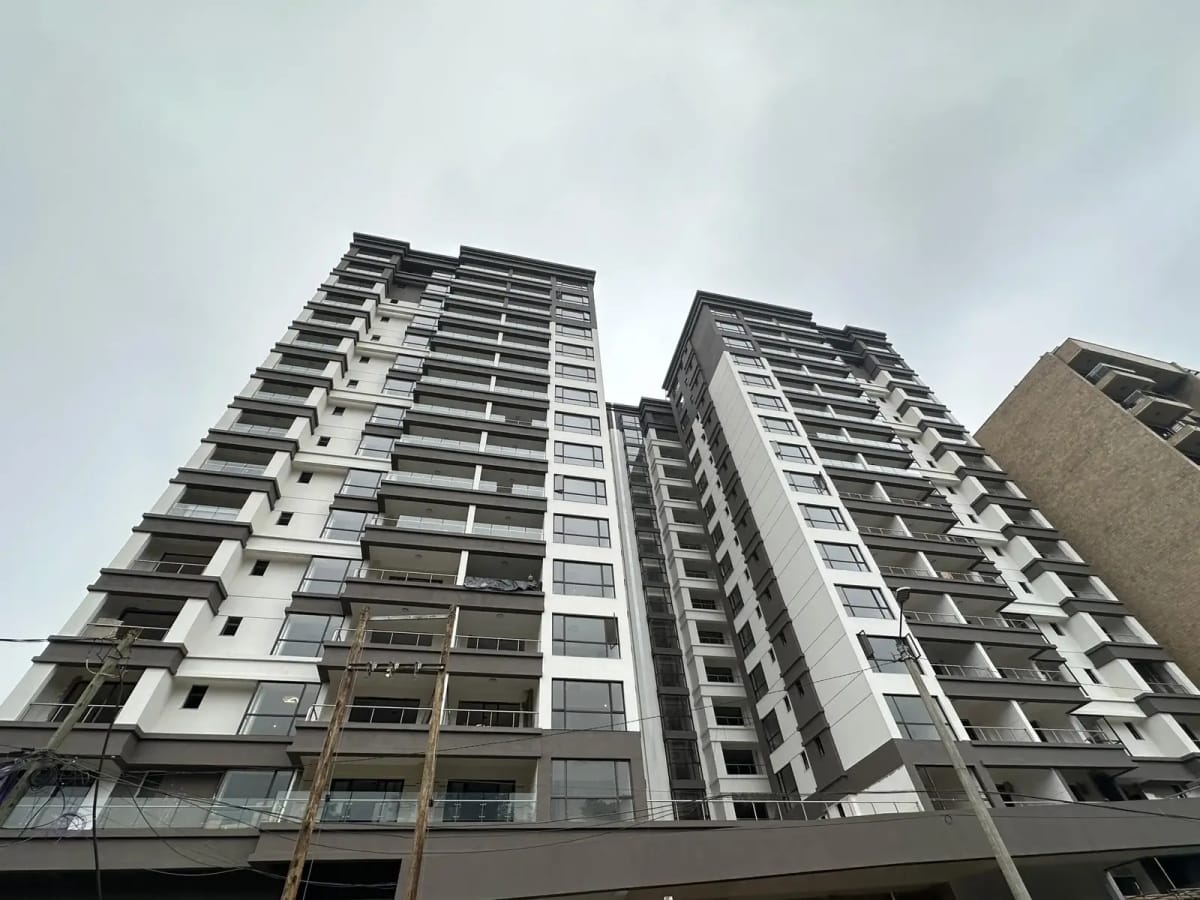 Modern multi-story residential building with balconies and facade