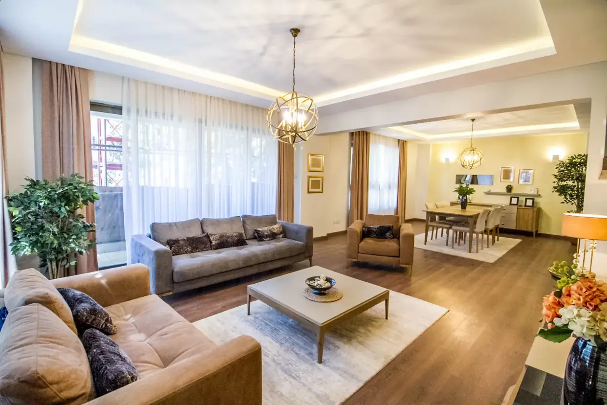 Spacious open-plan living room with multiple seating areas