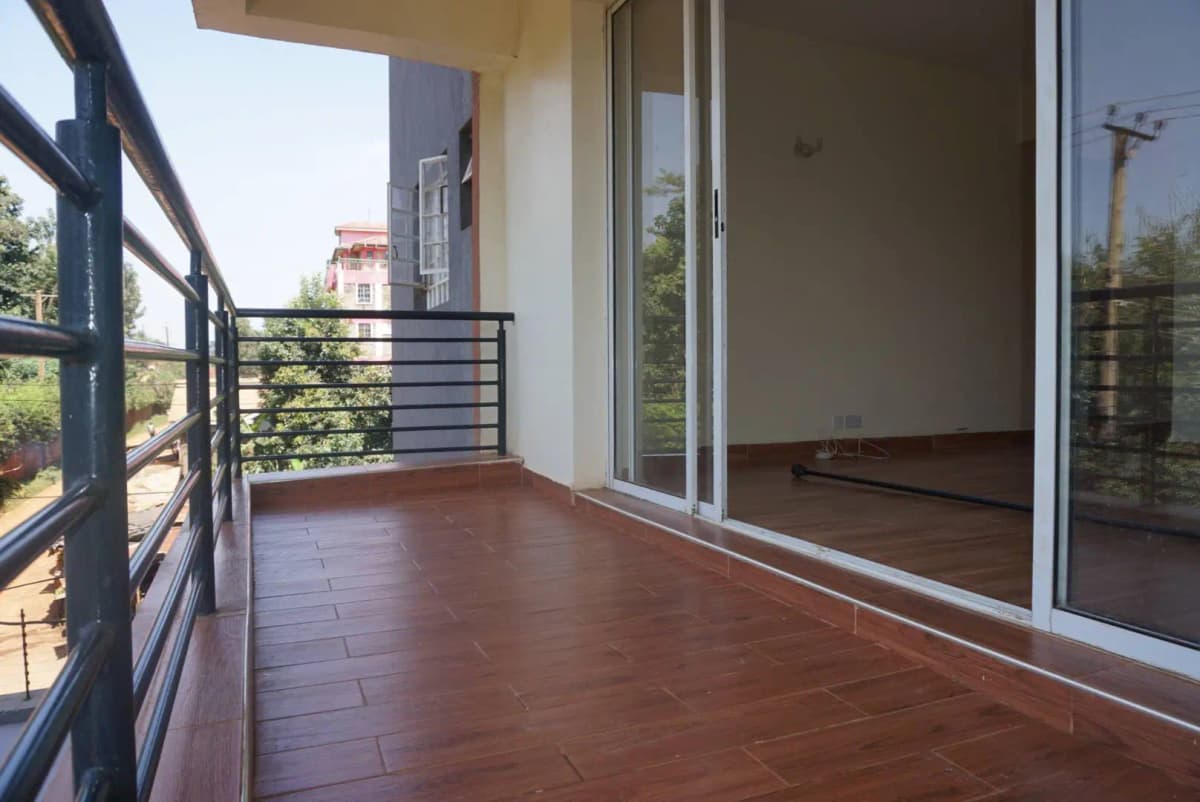 Spacious balcony with terracotta tiles and city views