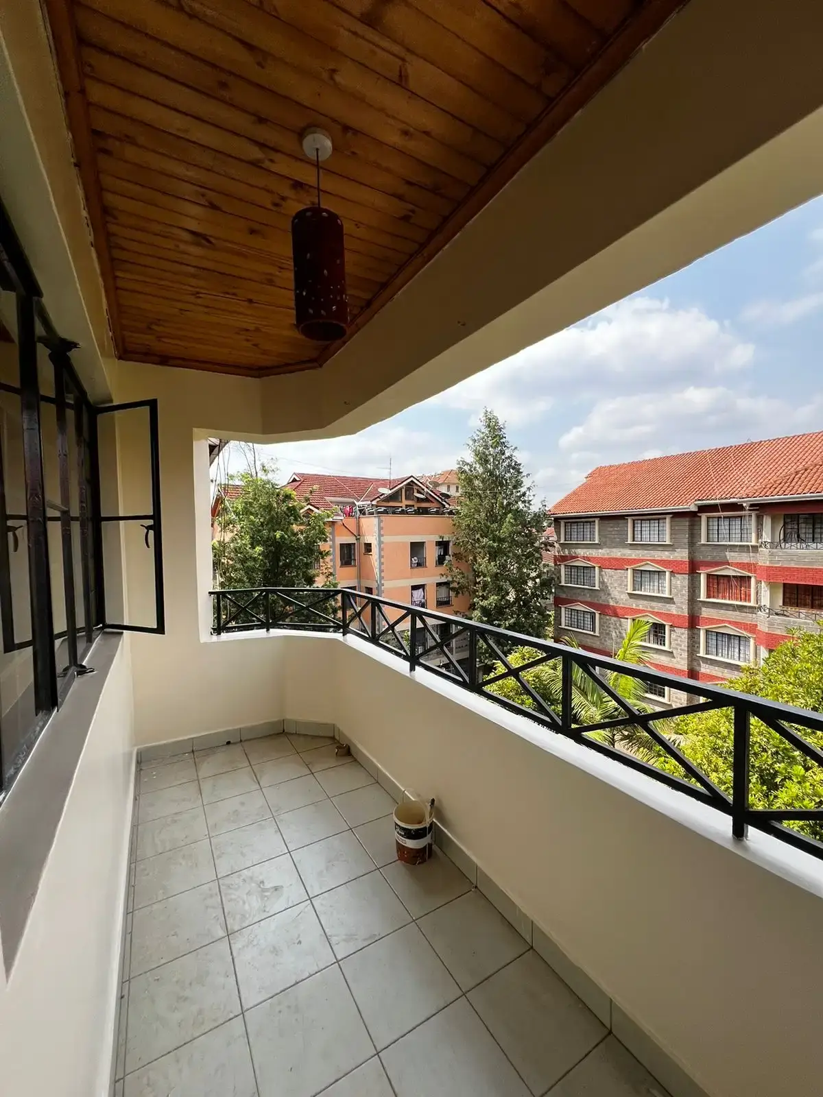 Spacious balcony with city and neighborhood views