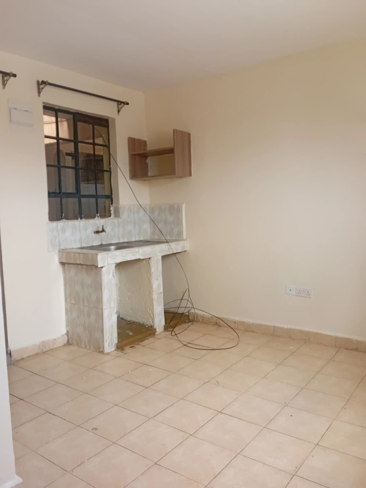 Compact kitchen with basic sink and stovetop installation