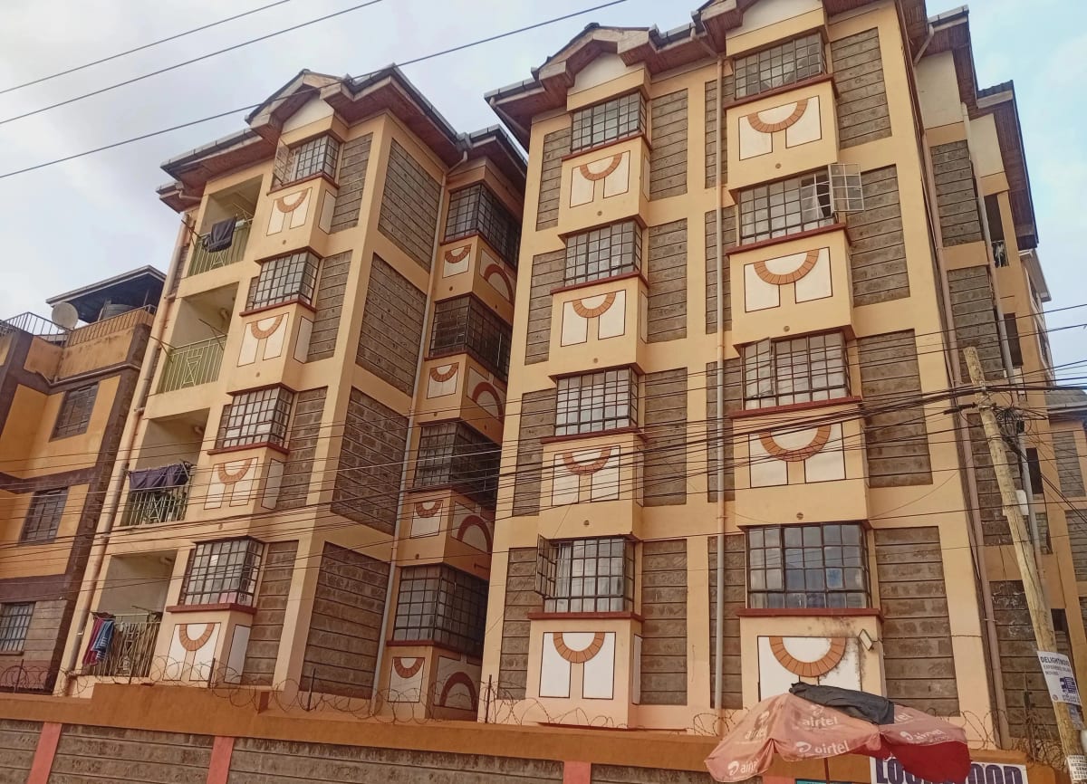 Multi-story residential building facade with distinctive architectural design